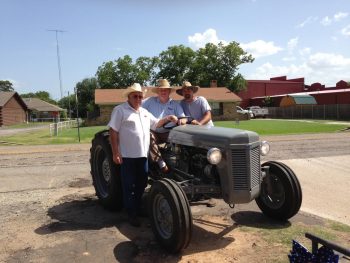 Marcus hanging out with friends on his 1952 Ferguson tractor