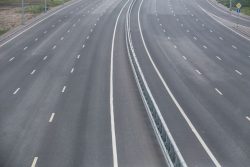Image of empty highway for blog post on do telematics devices save money?